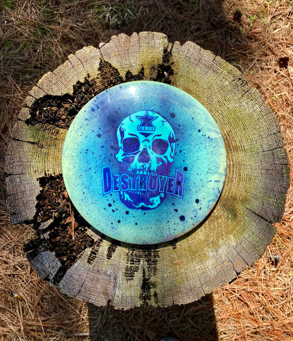 Star Destroyer disc golf disc spray dye with skull stencil